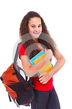 Teenage girl with backpack and books