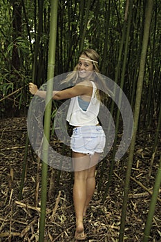 Teenage girl in a bamboo forest