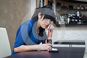 A teenage girl in the bar