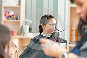 Teenage girl in a beauty salon on hair coloring and a haircut. Beauty concept. haircut, coloring