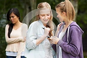 Teenage Girl Being Bullied By Text Message On Mobile Phone