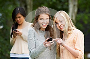 Teenage Girl Being Bullied By Text Message On Mobile Phone