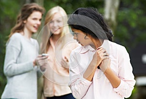 Teenage Girl Being Bullied By Text Message On Mobile Phone