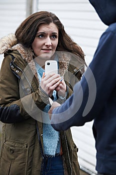 Teenage Girl Being Mugged For Mobile Phone