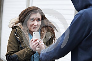 Teenage Girl Being Mugged For Mobile Phone photo