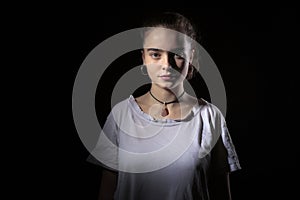 Teenage girl with black background photo