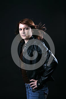 Teenage girl in black leather jacket