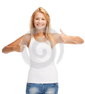 Teenage girl in blank white t-shirt with thumbs up