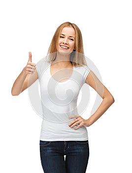 Teenage girl in blank white t-shirt with thumbs up