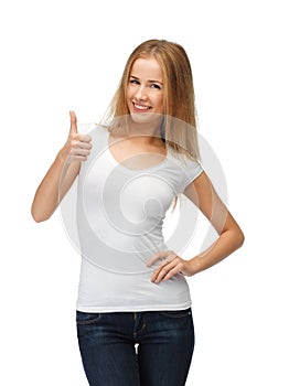 Teenage girl in blank white t-shirt with thumbs up