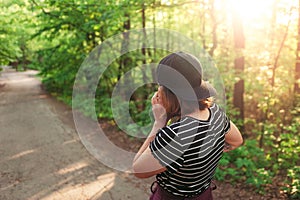 teenage girl in casual clothes and a snapback baseball cap