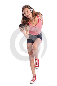 Teenage girl dancing happy fun to music on phone