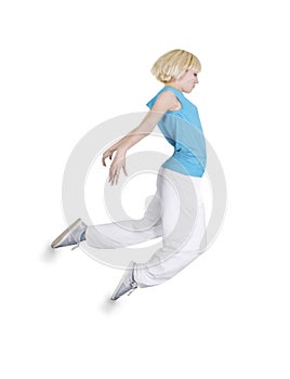 Teenage girl dancing hip-hop over white