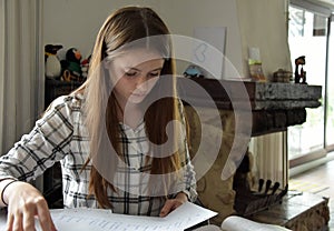 Teenage girl doing her maths homework