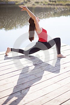 Teenage girl doing lunge posture