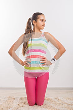 Teenage girl doing stretching exercises