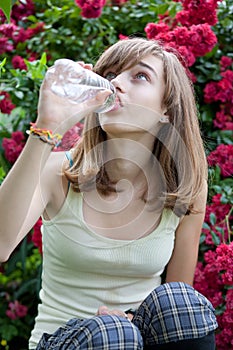 Teenage girl drinking water