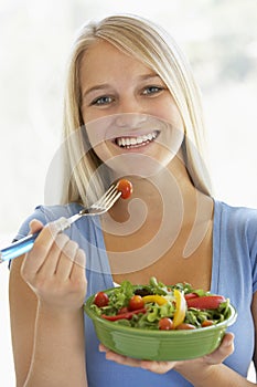 Teenage Girl Eating Fresh Salad