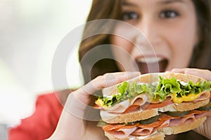 Teenage Girl Eating Sandwich