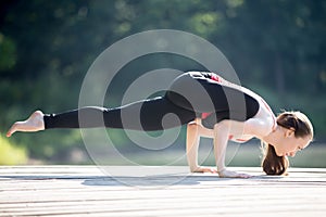 Teenage girl in Eka Pada Galavasana