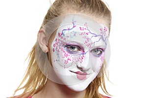 Teenage girl with face painting geisha girl