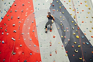 Teenage girl in a free climbing wall