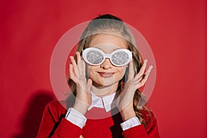 Teenage girl in glittering glasses