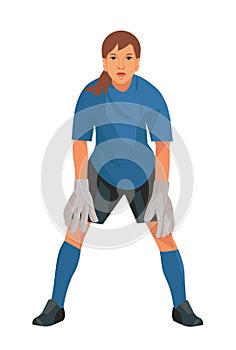 Teenage girl goalkeeper of junior women& x27;s football teem in blue uniform and gloves who stands upright in goal and