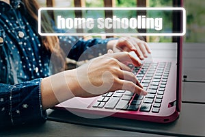 Teenage girl hands typing text on laptop