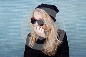 Teenage girl with hat sunglasses and attitude