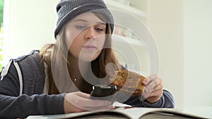 Teenage Girl Having Breakfast Whilst Sending Text Message