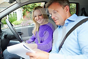 Teenage Girl Having Driving Lesson With Instructor