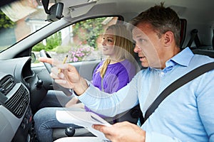 Teenage Girl Having Driving Lesson With Instructor