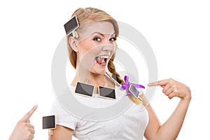 Teenage girl having little blackboards in hair