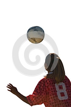 Teenage Girl Heading Soccer Ball