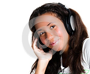 Teenage girl with headphones, listening to music