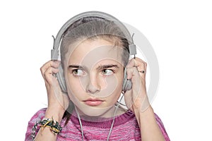 Teenage girl hears something scary on headphones photo