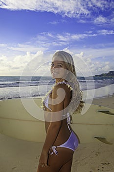 Teenage girl with her surfboard