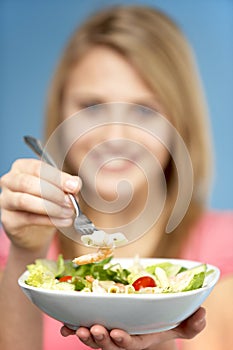 Teenage Girl Holding Bowl Of Salad