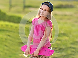 Teenage girl holding her pink board