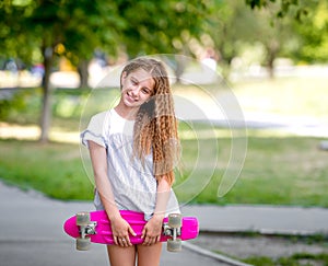 Teenage girl holding her pink board