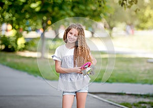 Teenage girl holding her pink board