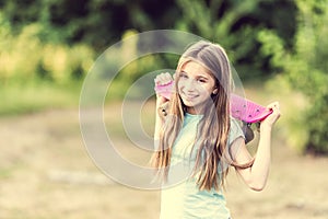 Teenage girl holding her pink board