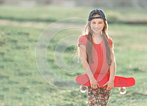 Teenage girl holding her pink board