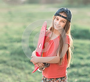 Teenage girl holding her pink board