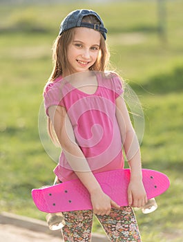 Teenage girl holding her pink board