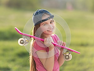 Teenage girl holding her pink board