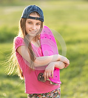 Teenage girl holding her pink board