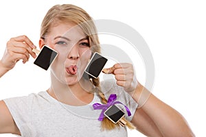 Teenage girl holding little school blackboards