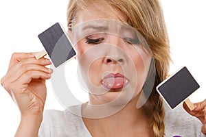 Teenage girl holding little school blackboards